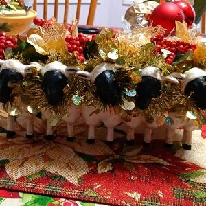 5 sheep planter all decked out for Christmas.